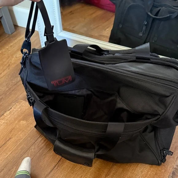 Tumi black travel bag/carryon